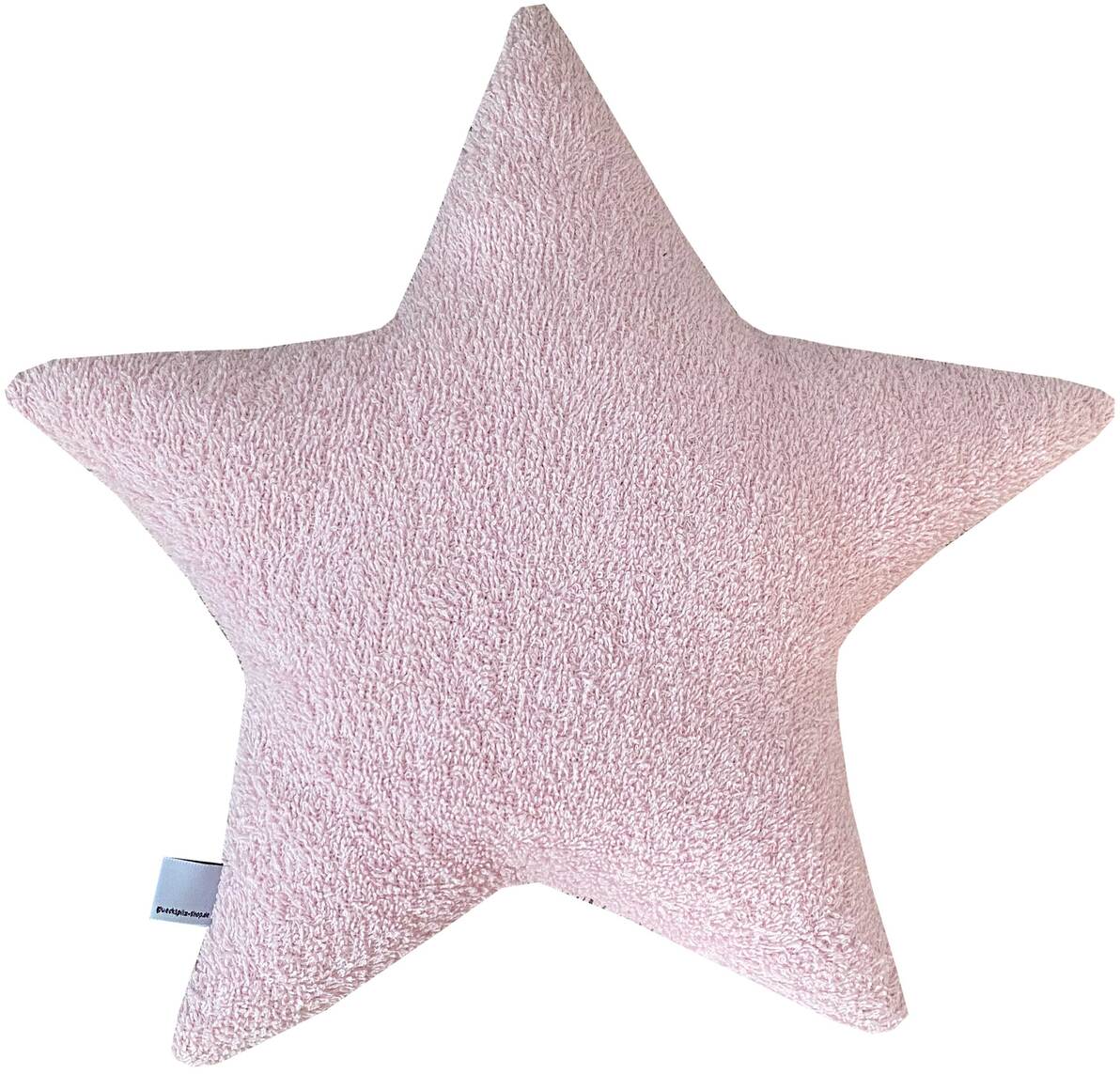 Ein rosa Sternenkissen aus weichem Stoff mit einem weißen Namensschild an der Seite.