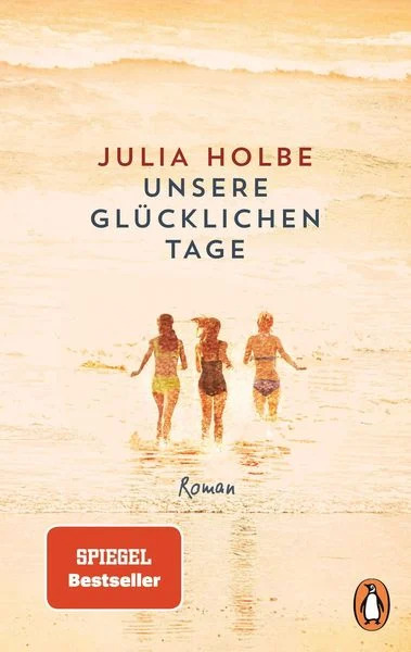 Ein Buchcover des Romans 'Unsere glücklichen Tage' von Julia Holbe, gezeigt mit drei lachenden Personen am Strand, die sich an den Händen halten und ins Meer laufen. Der Himmel und das Meer sind in warmen Orange- und Gelbtönen gehalten. Das Buch ist ein Spiegel Bestseller.